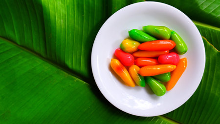 Thai traditional dessert by sweet green bean and glaze with jelly. sweet chilli shape.の写真素材