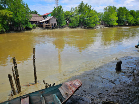 Abandoned wood boat beside canal at fisherman's village for decoration on lifestyle in countryside...
