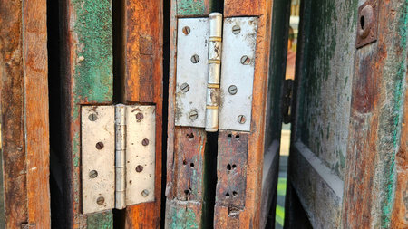 Wood door with door hinge background for decoration in old town and home decor country style.