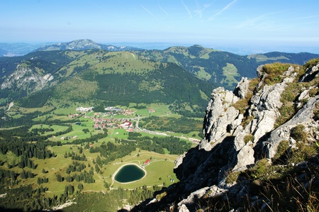 A beautiful view of a mountain in a valley with a small lakeの写真素材