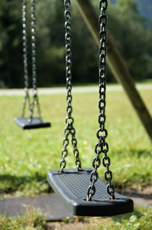 An abandoned swingの写真素材