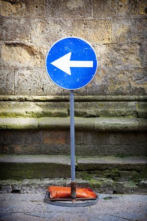 Road sign - arrow pointing leftの写真素材