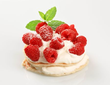 Pancakes with curd cheese topped with fresh raspberries の写真素材