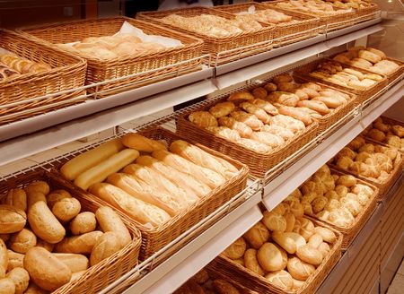 Variety of baked products on shelves at a supermarket 