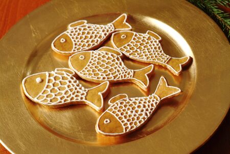 Christmas gingerbread cookies on a golden plate の写真素材