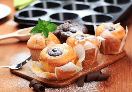 Sponge cakes with chocolate center and muffinsの写真素材