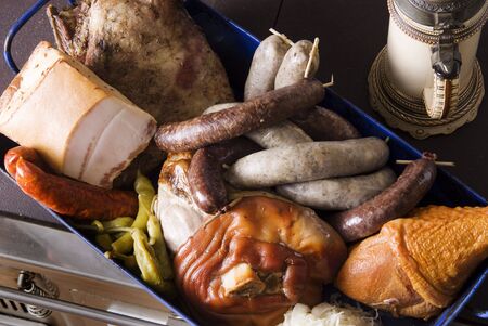 Variety of meat products in a baking panの写真素材