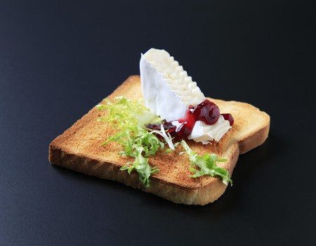 Slice of toasted bread and French cheeseの写真素材