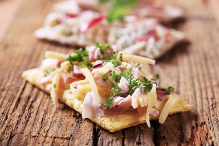 Crackers with bacon and cheese topping - detail