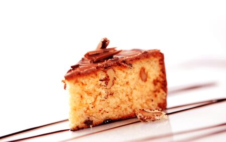 Slice of chocolate glazed nut cake - closeupの写真素材