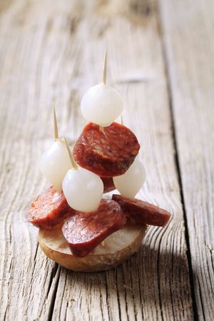 Party food - Kielbasa and onion canapes の写真素材