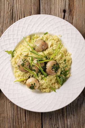 Couscous with button mushrooms styled with spring onionの写真素材