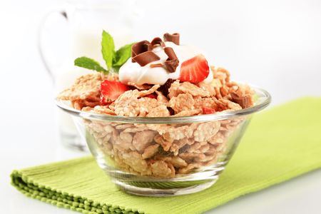 Bowl of breakfast cereal and white yogurt 