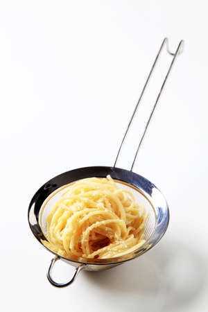 Cooked spaghetti sprinkled with grated cheeseの写真素材