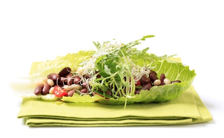 Red beans, sprouts and salad greens in a lettuce leaf の写真素材