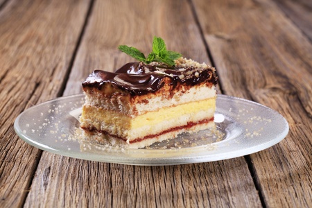 Slice of delicious cake with chocolate icing