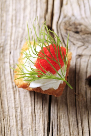 Pastry-based canape with cheese spread and caviarの写真素材