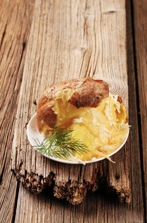Baked potato with two kinds of cheeseの写真素材