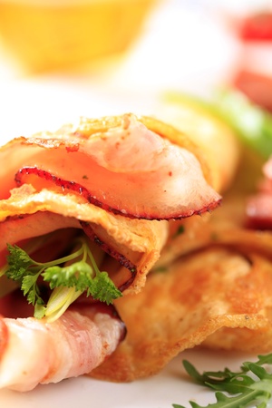 Fried egg omelet and bacon - detailの写真素材