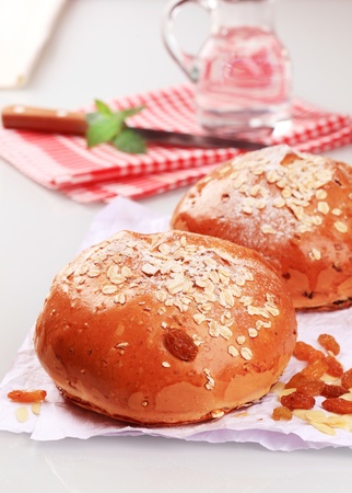 Two loaves of sweet bread topped with rolled oatsの写真素材
