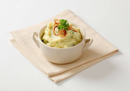 Bowl of mashed potato and browned onionの写真素材