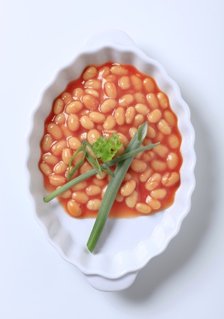 Baked beans in a porcelain casserole dishの写真素材