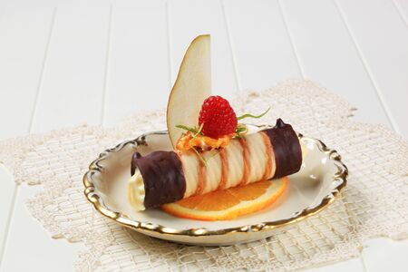 Chocolate dipped wafer tube filled with cream