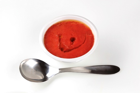Bowl of tomato paste and spoon - studioの写真素材