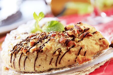 Marzipan crescent cookie sprinkled with chopped almonds