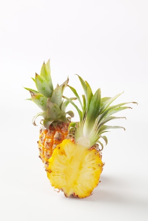 Fresh pineapple cut into halves - studio shotの写真素材