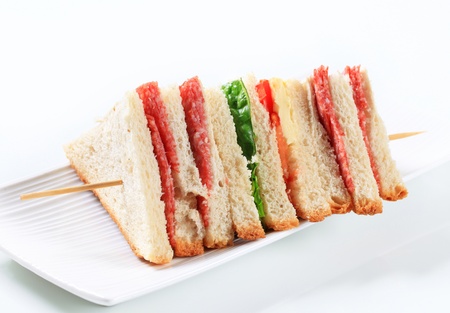 Multi-layered sandwich with thin sliced salamiの写真素材