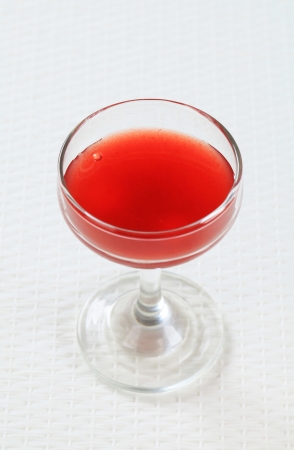 Red juice in a wine glassの写真素材
