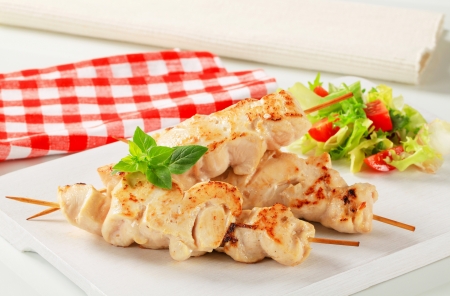 Chicken breast meat on wooden skewersの写真素材