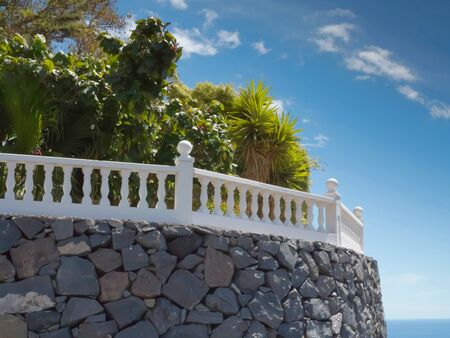 Garden terrace with view of the sea の写真素材