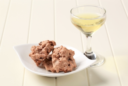 Chocolate meringue cookies with chopped nuts insideの写真素材