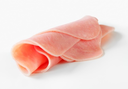 Studio shot of rolled slices of hamの写真素材