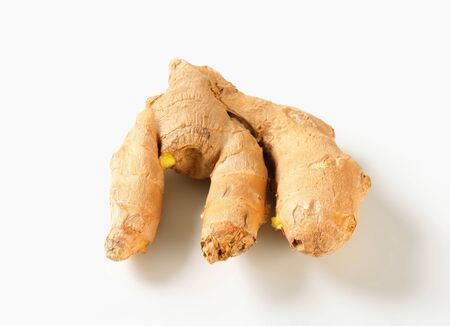 Fresh ginger root on white background