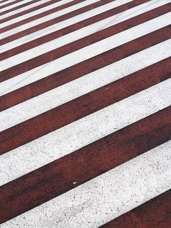 Red and white zebra crossing backgroundの写真素材
