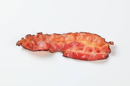 Crispy pan-fried strip of baconの写真素材