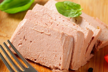 Sliced liver pate on cutting boardの写真素材