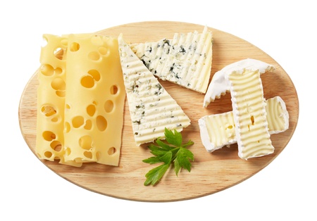 Variety of cheeses on a cutting board 