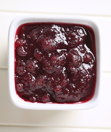 Berry fruit sauce in a small square dish