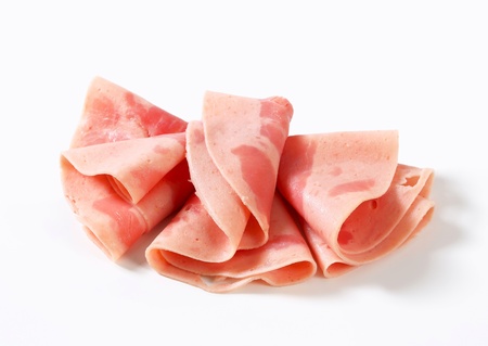 Thin slices of ham - studio shotの写真素材