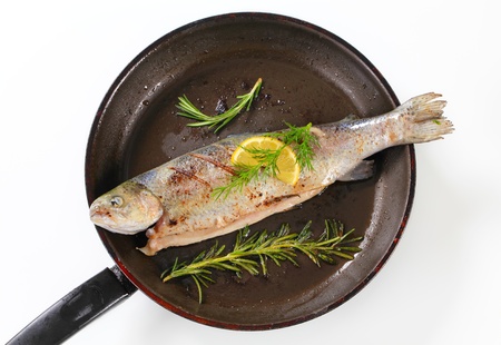 Grilled trout on a frying panの写真素材