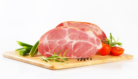 Smoked pork neck on cutting boardの写真素材