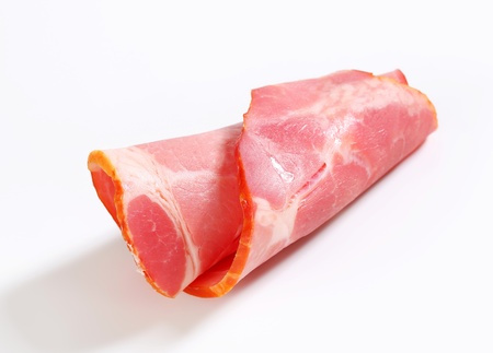 Thin slice of smoked pork neck - rolled upの写真素材