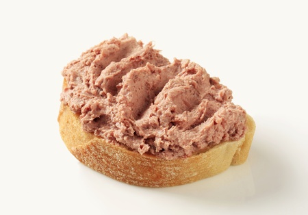 Slice of bread with meat-based spreadの写真素材