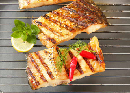 Grilled carp fillets on a gridの写真素材