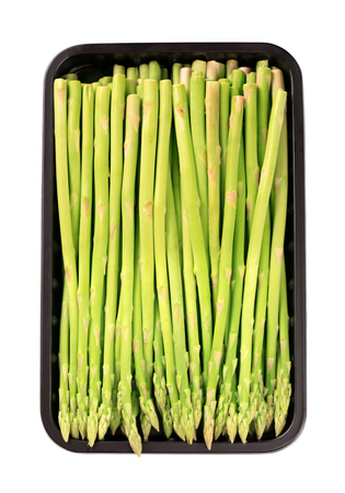 Fresh asparagus spears in plastic containerの写真素材