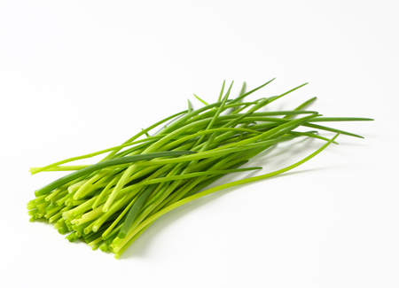 Fresh chives leaves on white background